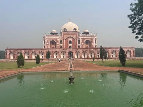       Humayun's Tomb with its reflection in a water feature.
  