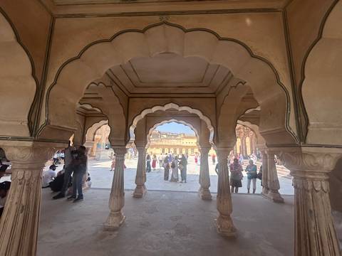       Interior of Amer Fort with detailed architecture.
  