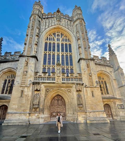 Facade of a large, historic stone building.