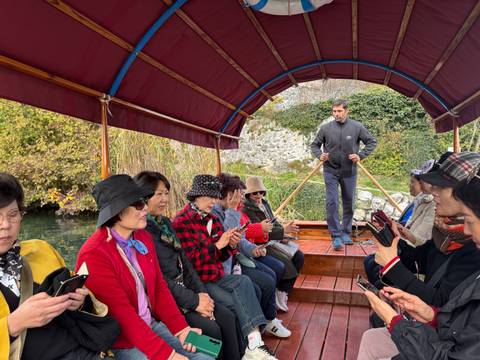       Group on a boat ride with a guide.
  