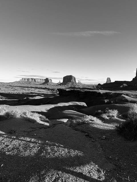       Black and white landscape of Monument Valley.
  