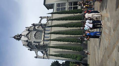      People in front of the Medellin Metropolitan Cathedral.
  