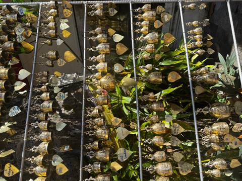       Many small hanging bells and heart-shaped decorations.
  