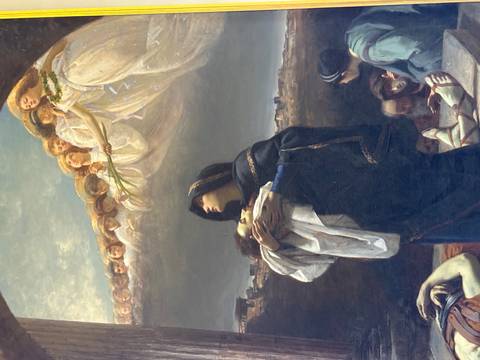 A painting depicting a religious scene with angels overhead.