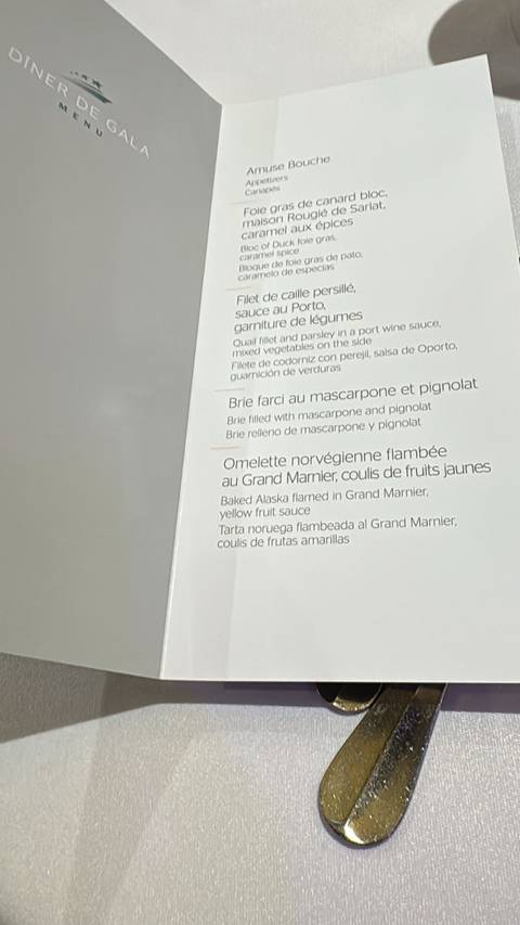 Close-up of a menu detailing dishes.