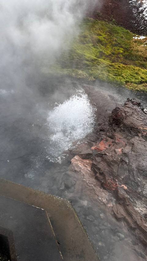 Volcanic activity with bubbling hot spring.