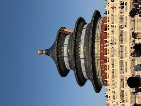 A historical temple with intricate details and a dome structure.