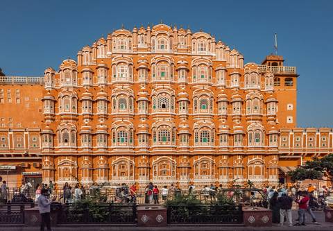       Intricately designed facade of a historic building with many windows.
  