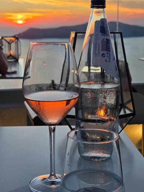 Glass of rose wine with a sunset view.