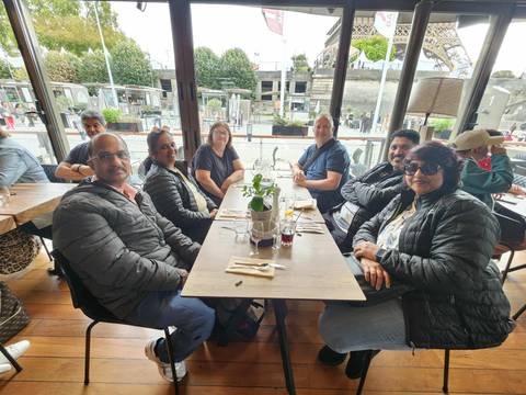 Group of people dining indoors.