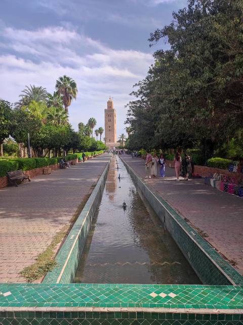       Promenade in Marrakesh with Koutoubia Mosque in view.
  