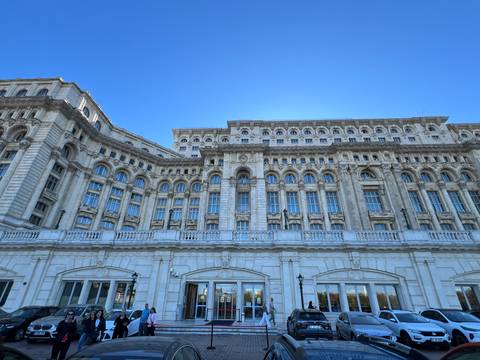 Large neoclassical government building with detailed facade.