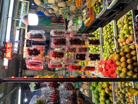 Market stall with various fruits and vegetables.