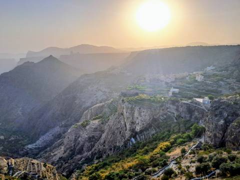 A panoramic view of a mountainous landscape at dusk.