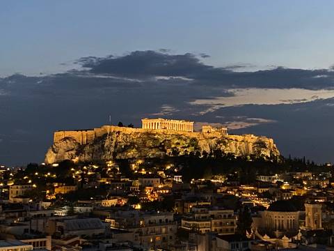       The Acropolis of Athens illuminated at night.
  