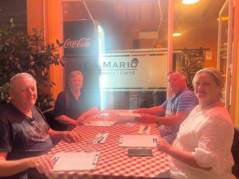 Group dining at Da Mario restaurant with a relaxed atmosphere.