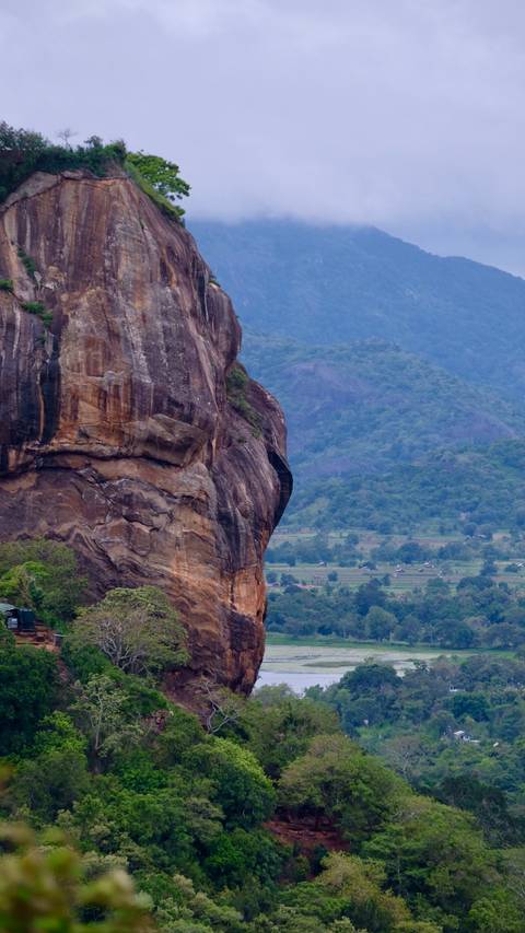       Majestic rock formation in a mountainous landscape.
  