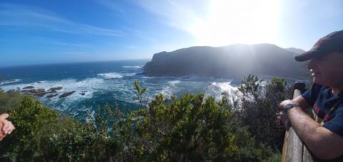 View of the coast from a wooden deck.