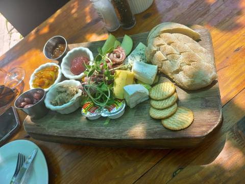       Charcuterie board with various cheeses and meats.
  