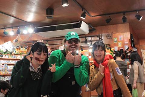 People in costumes posing for a photo.