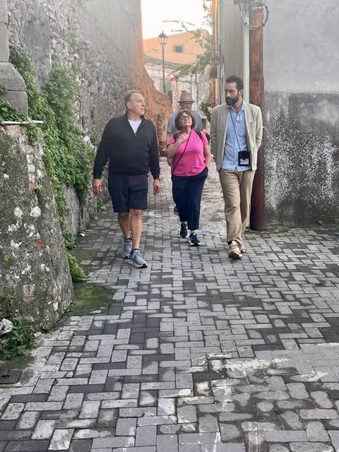       Group walking on a stone path
  