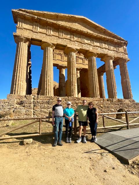 Group posing in front of a historic temple