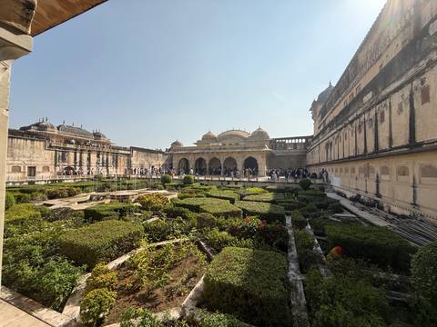 Wide view of historic architecture inlaid with detailed gardens.