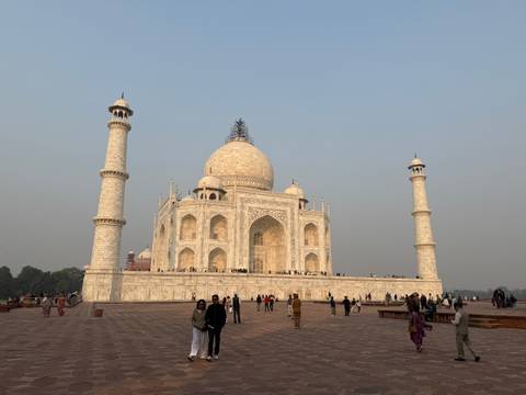 The Taj Mahal with visitors in front.