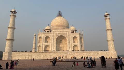 People visiting the magnificent Taj Mahal.
