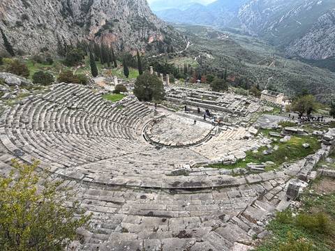       Ancient amphitheater with surrounding landscape.
  