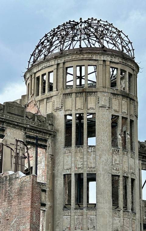       A bombed-out industrial building with visible structural damage.
  