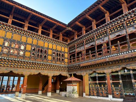       An ornate interior with detailed wooden carvings.
  