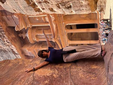 Tourist posing at the Treasury in Petra.
