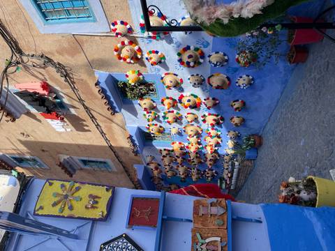 Street with blue painted walls and decorations.