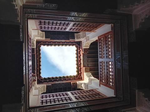       View of the sky from within a traditional courtyard.
  