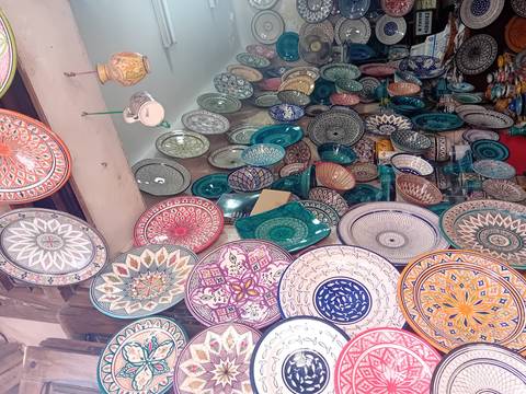 Colorful pottery displayed for sale.