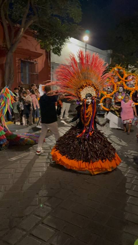 Parade with people in costume and face paint.