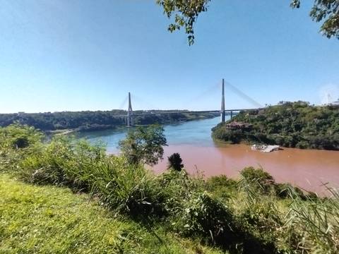       Bridge over a river with different water colors.
  