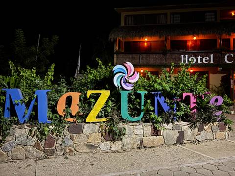 Colorful Mazunte sign at night.