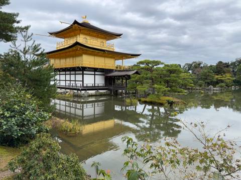 Golden Pavilion with reflection in the water in Kyoto.