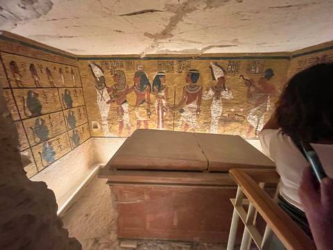 Ancient tomb with colorful wall paintings.