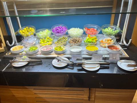       Buffet with a variety of salads and toppings.
  