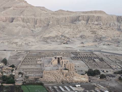 Aerial view of archaeological ruins and mountainous area.