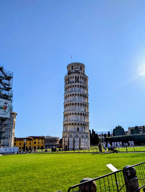 Leaning Tower of Pisa with clear blue sky in the background.