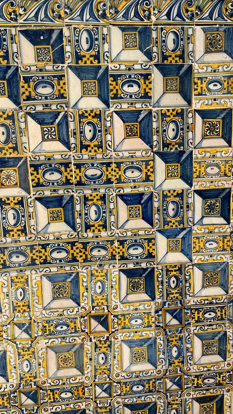 Decorative tiles with intricate blue and yellow patterns.