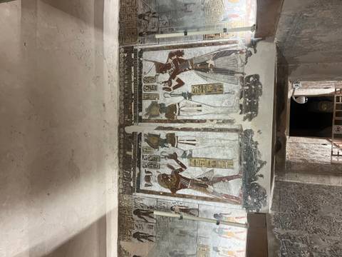 Detailed wall painting depicting ancient figures.