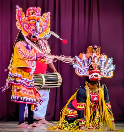 Traditional Sri Lankan masked dancers performing.