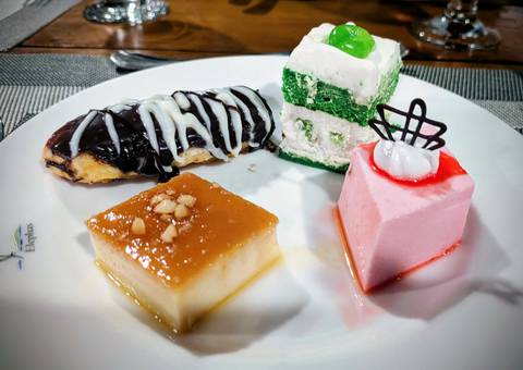 A plate with various dessert items.