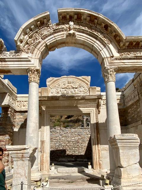 Ancient architectural ruins featuring a beautifully carved stone archway.