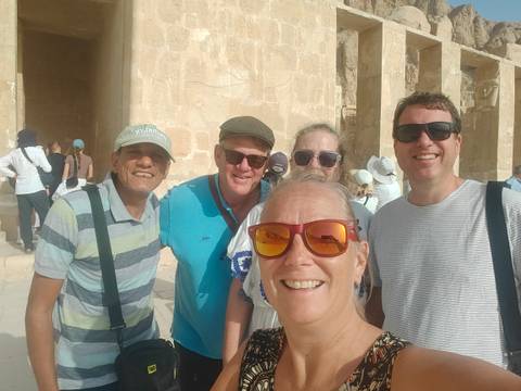 Group selfie in front of an ancient structure.